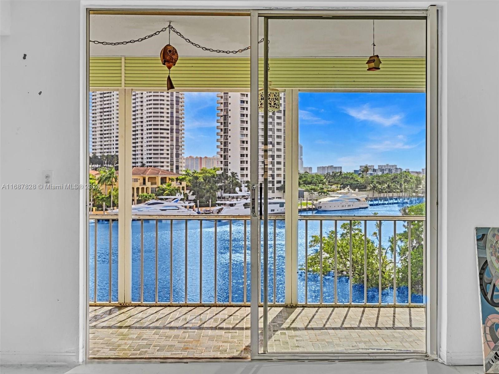 2980 Point E Drive, Unit D508 Aventura, FL 33160 - Photo 7 of 53 a view of a glass door with a glass door