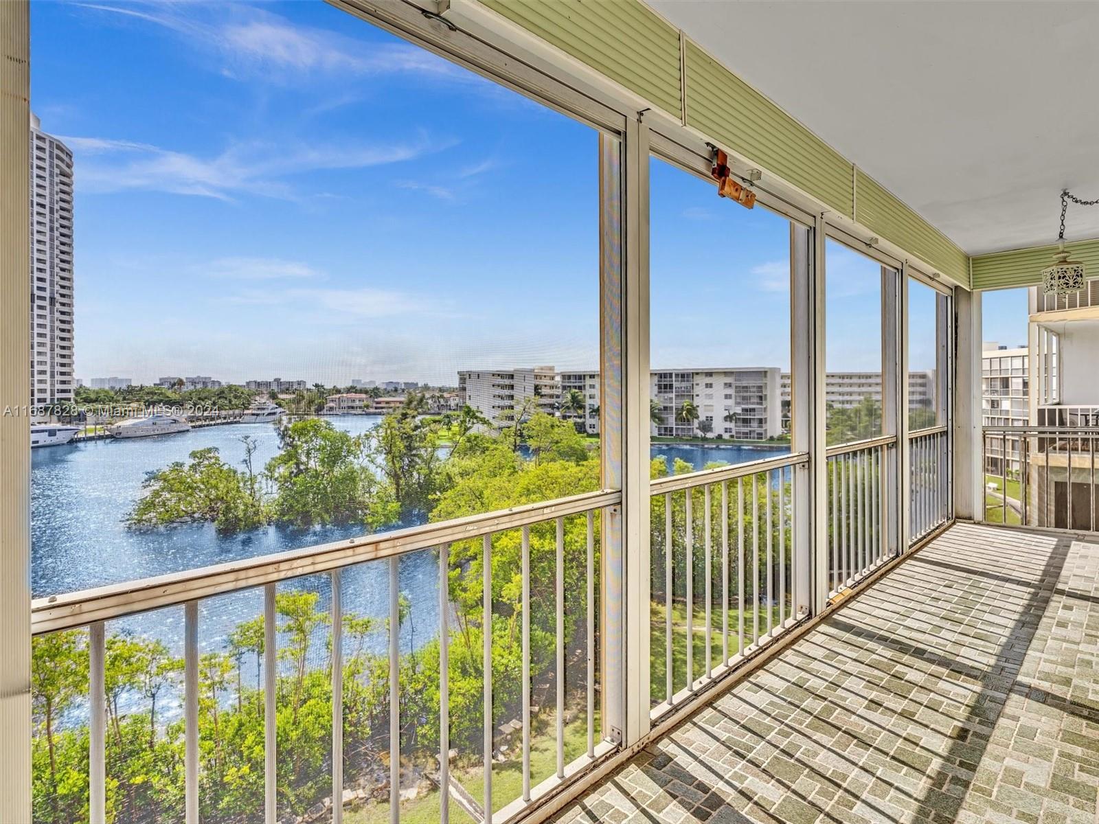 2980 Point E Drive, Unit D508 Aventura, FL 33160 - Photo 9 of 53 a view of a balcony with wooden floor