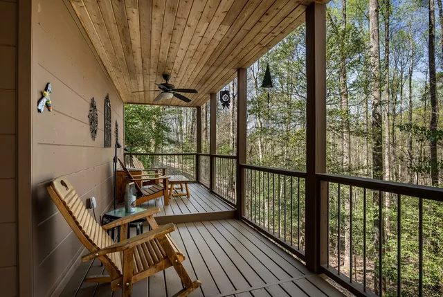 a view of a balcony with wooden floor