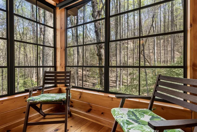 a reading room with furniture and a window