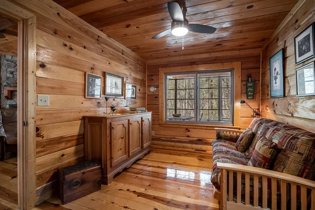 a spacious bedroom with bed and a window