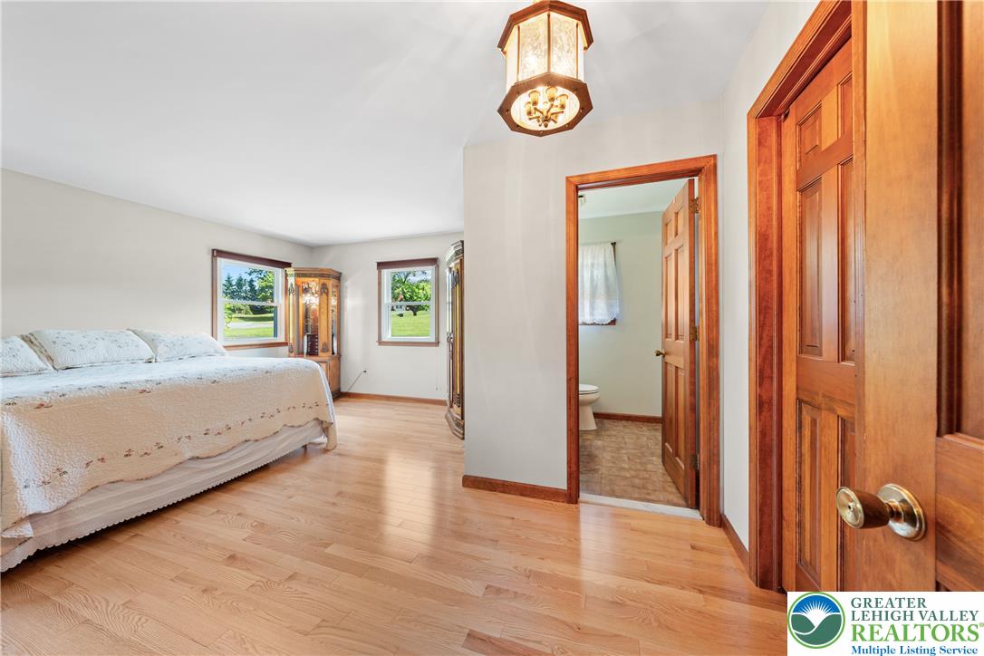 947 Tamenend Road Bath, PA 18014 - Photo 25 of 61 Hardwood floors and generous windows create a light-filled and comfortable bedroom retreat.