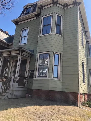 a front view of a house with stairs