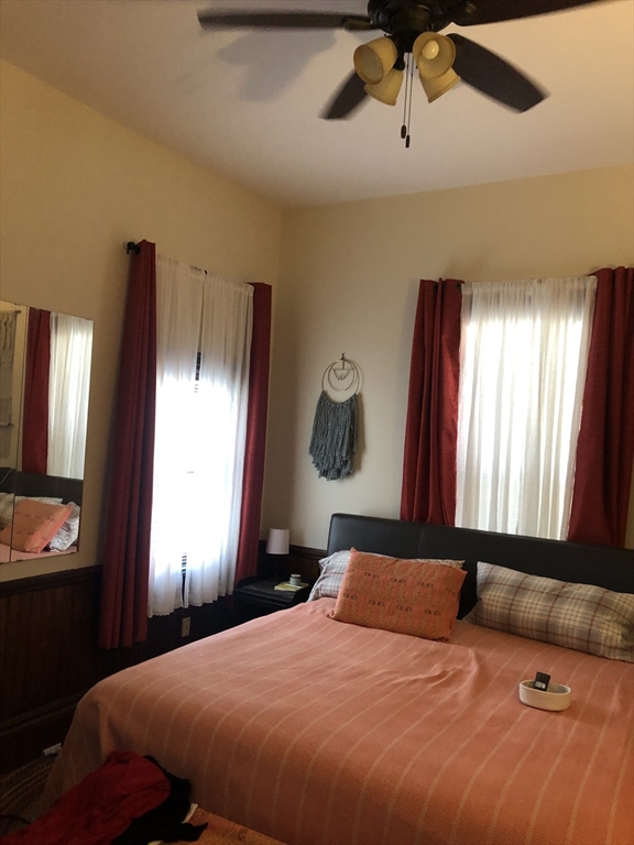 27 Warren Avenue, Unit 1 Somerville, MA 02143 - Photo 12 of 18 a bedroom with a large bed and a window