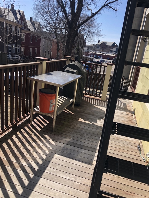 27 Warren Avenue, Unit 1 Somerville, MA 02143 - Photo 17 of 18 a view of a balcony with wooden floor