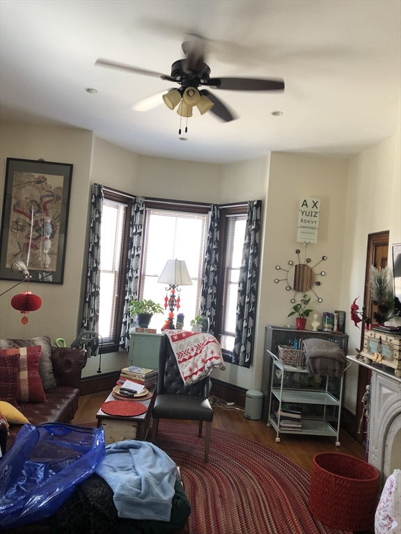 27 Warren Avenue, Unit 1 Somerville, MA 02143 - Photo 5 of 18 a living room with furniture and a flat screen tv