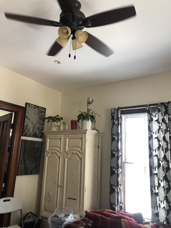 27 Warren Avenue, Unit 1 Somerville, MA 02143 - Photo 7 of 18 a view of a storage & utility room with refrigerator washer
