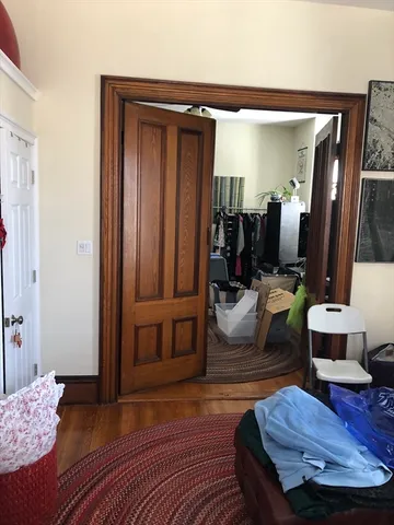 a living room with furniture a rug and a window