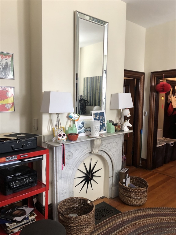 27 Warren Avenue, Unit 1 Somerville, MA 02143 - Photo 10 of 18 a living room with furniture a rug and a window