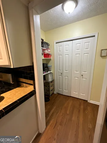 a bed room with a bed and a night stand