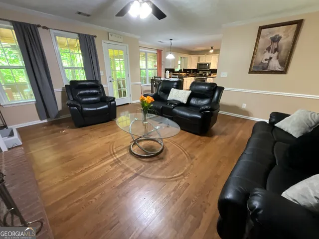 a bed room with furniture and a flat screen tv
