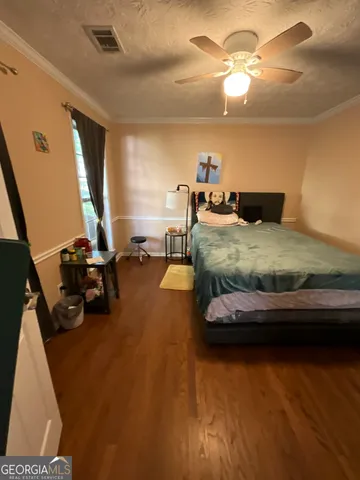 a view of walk in closet with clothes