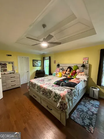 a living room with a toilet and a flat screen tv