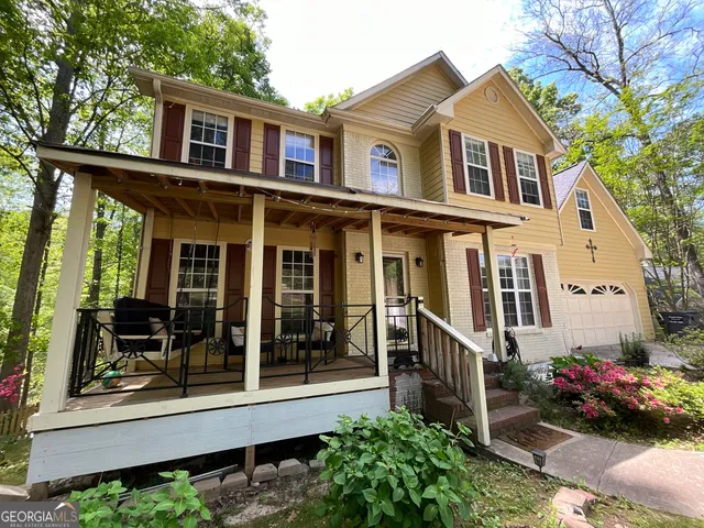 a view of a house with a garden