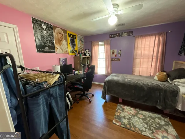 a bathroom with a toilet sink and shower