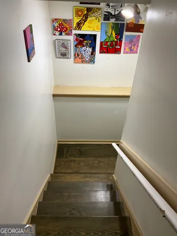 a outdoor sitting area with furniture and wooden floor