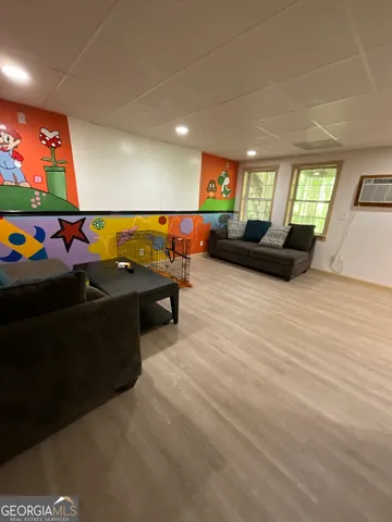 a view of a patio with table and chairs barbeque with wooden floor