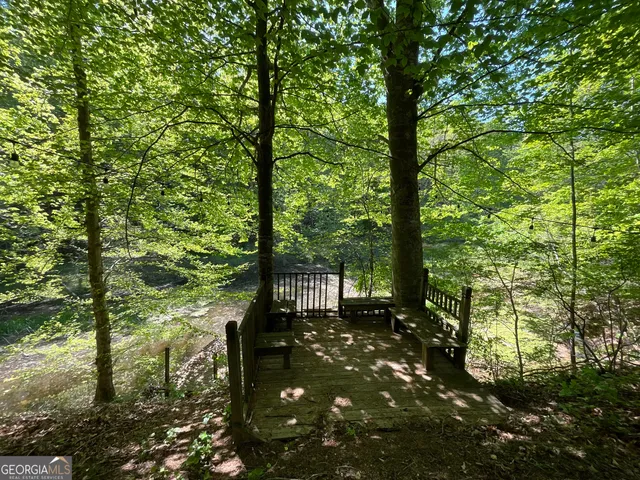 a view of a dining room with furniture wooden floor and chandelier