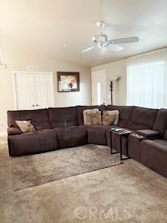 24922 Muirlands Boulevard, Unit 115 Lake Forest, CA 92630 - Photo 14 of 17 a living room with a couch and chandelier