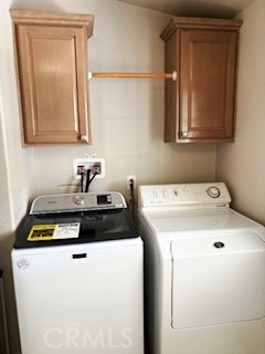 24922 Muirlands Boulevard, Unit 115 Lake Forest, CA 92630 - Photo 15 of 17 a utility room with dryer and washer