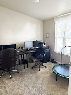 24922 Muirlands Boulevard, Unit 115 Lake Forest, CA 92630 - Photo 8 of 17 a view of a workspace with furniture and a window