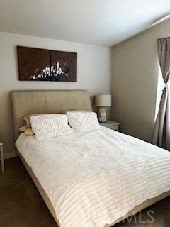 24922 Muirlands Boulevard, Unit 115 Lake Forest, CA 92630 - Photo 10 of 17 a large white bed in a small room