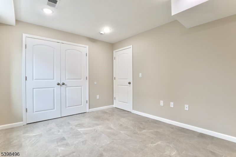 32 Garibaldi Avenue, Unit 1 Newark, NJ 07114 - Photo 11 of 12 an empty room with closet area