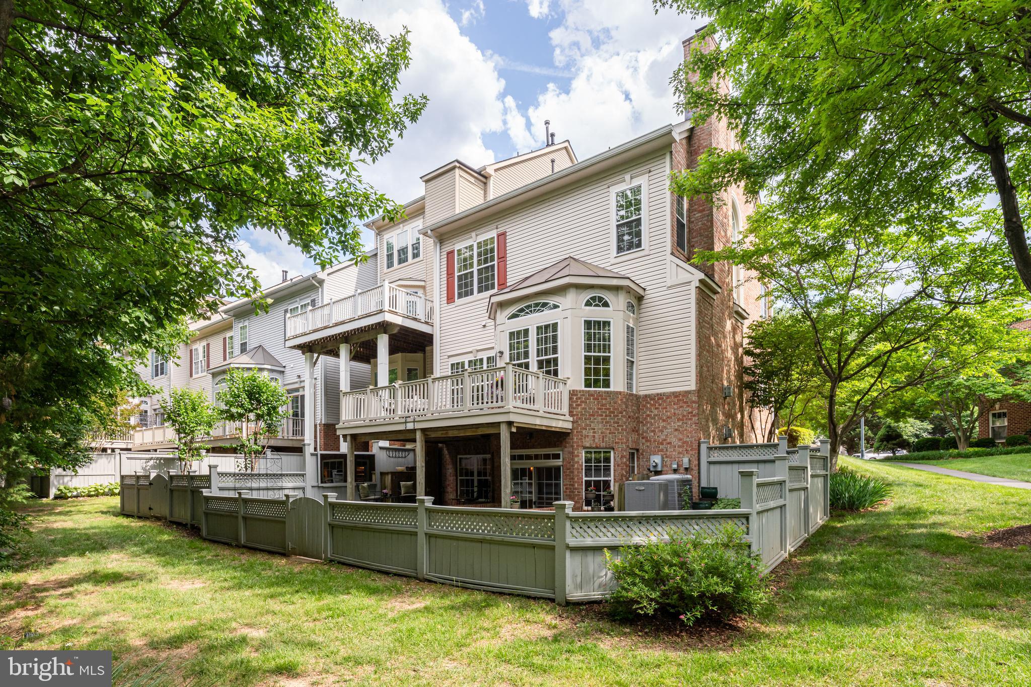 1925 Logan Manor Drive Reston, VA 20190 - Photo 43 of 61 a front view of a house with a yard table and chairs