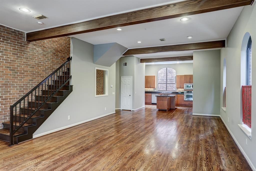 Welcome Home to 3300 Taft! The large open concept living spaces have high ceilings and exposed brick!