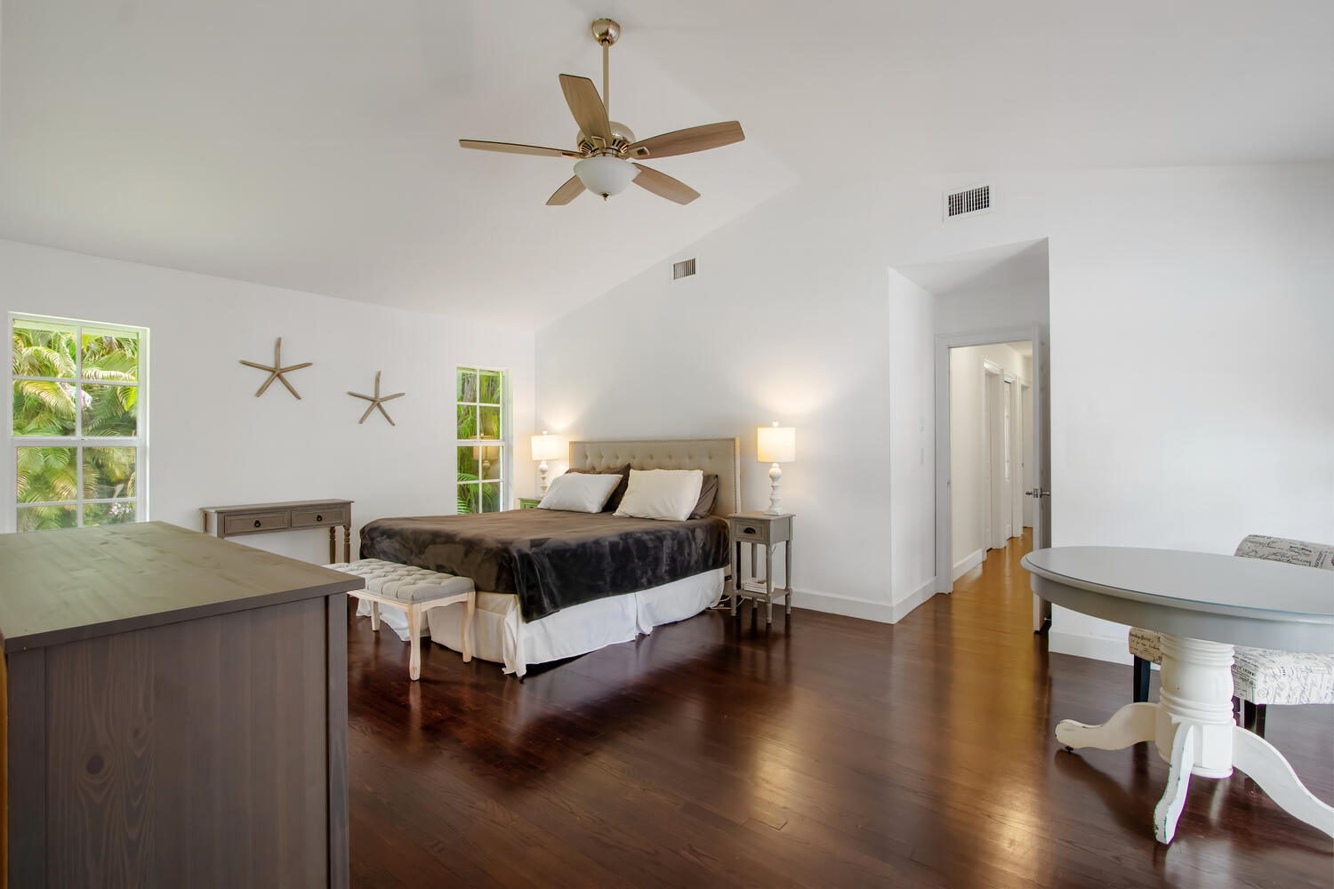 12327 Quercus Lane Wellington, FL 33414 - Photo 12 of 34 a bedroom with a bed and a table