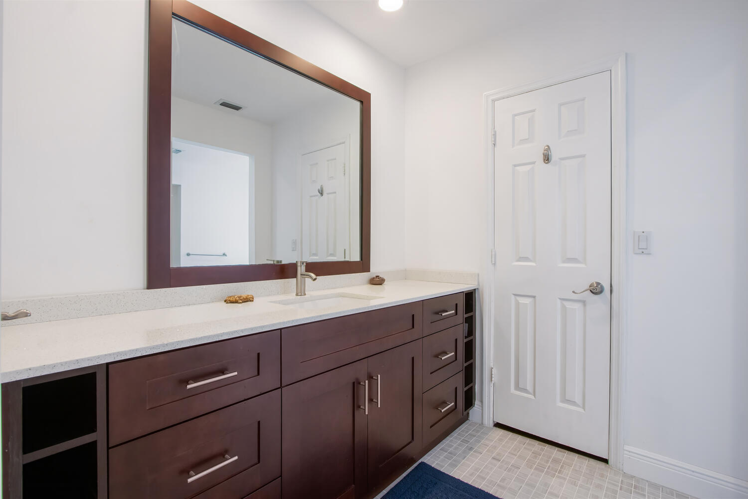 12327 Quercus Lane Wellington, FL 33414 - Photo 13 of 34 a bathroom with a double vanity sink and mirror