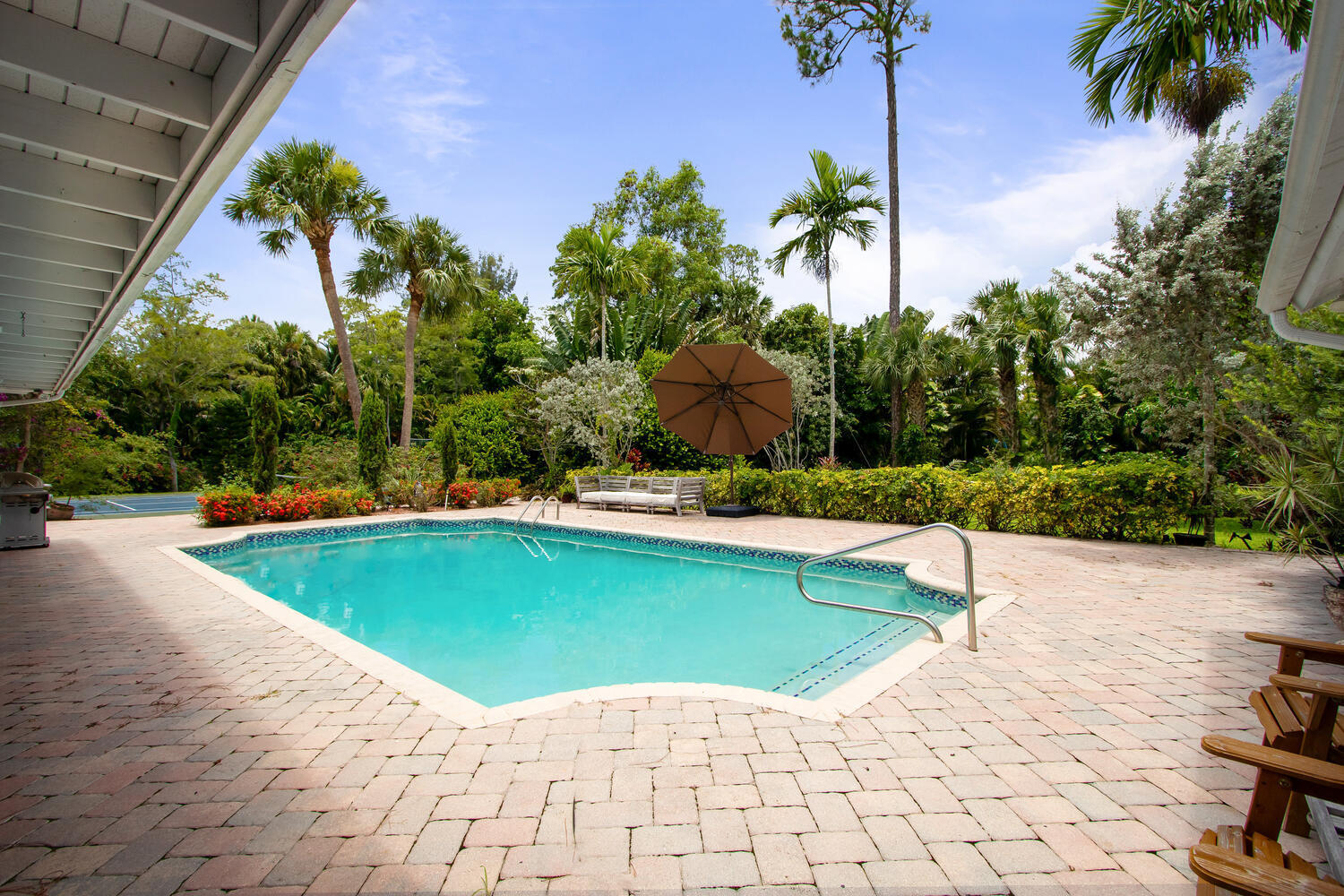 12327 Quercus Lane Wellington, FL 33414 - Photo 22 of 34 a view of a swimming pool with a yard