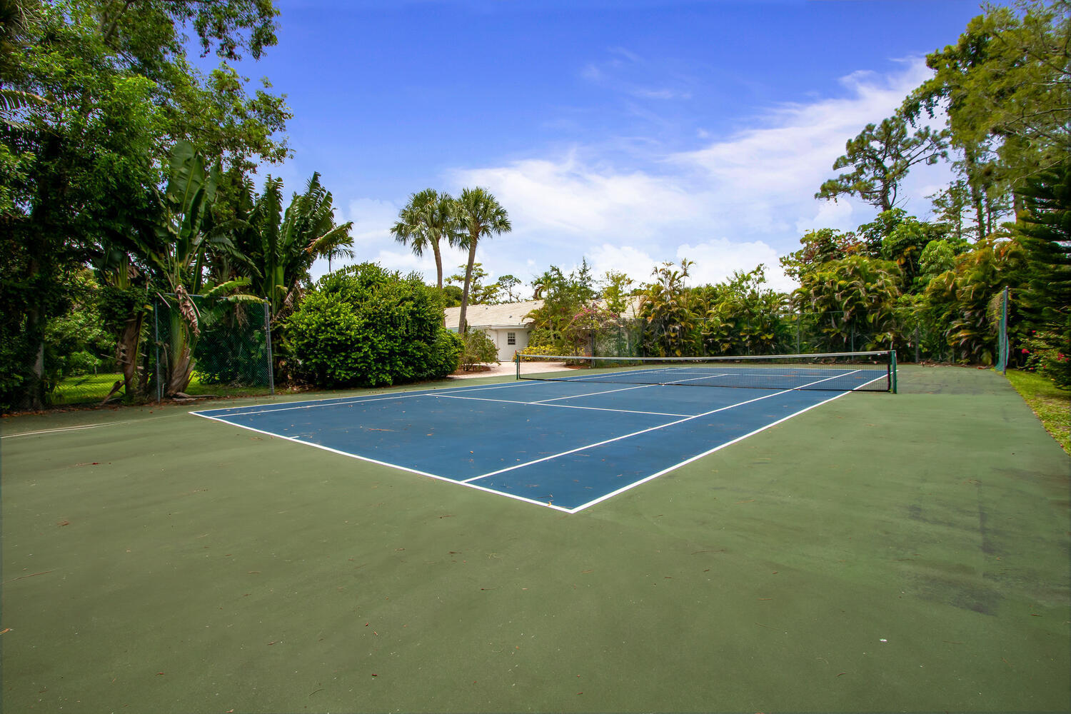 12327 Quercus Lane Wellington, FL 33414 - Photo 25 of 34 a view of a tennis court