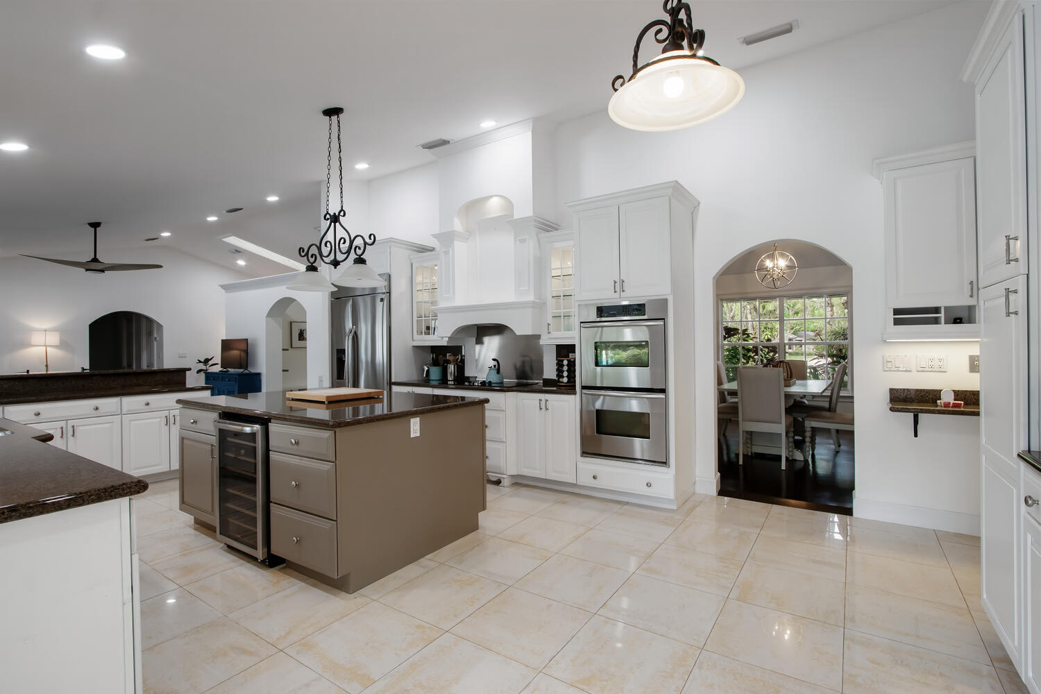 12327 Quercus Lane Wellington, FL 33414 - Photo 9 of 34 a large kitchen with cabinets and stainless steel appliances