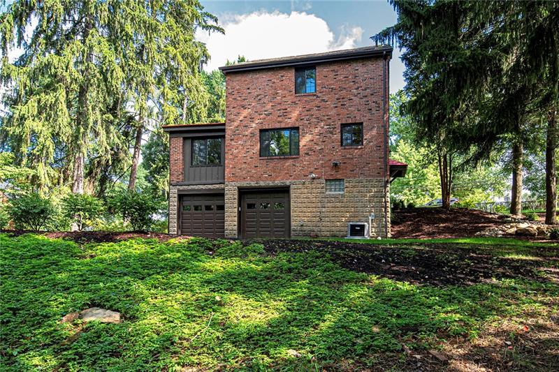3325 Comanche Road Pittsburgh, PA 15241 - Photo 25 of 25 View of the Rear Exterior Showing the 2-Car Integral Rear Entry Garage and Wonderful Wooded Lot. Don't 3325 Comanche Road is Ready for New Owners. Make it Yours Today!