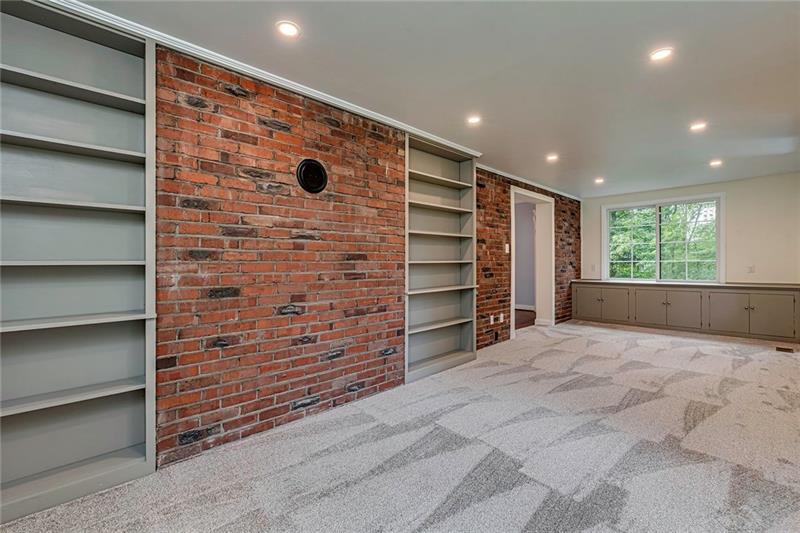 3325 Comanche Road Pittsburgh, PA 15241 - Photo 9 of 25 The Family Room Features Wonderful Built-Ins and a Charming Brick Accent Wall