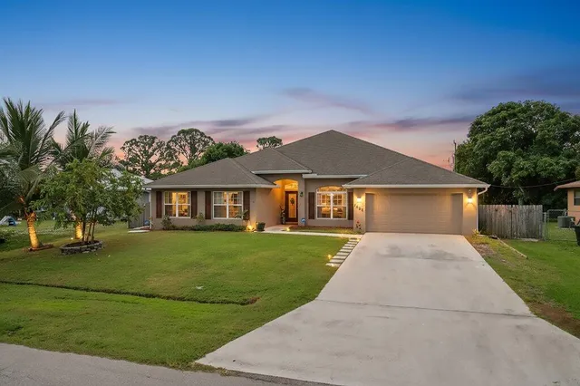front view of a house with a yard