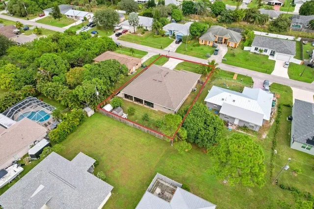 an aerial view of a house with a garden