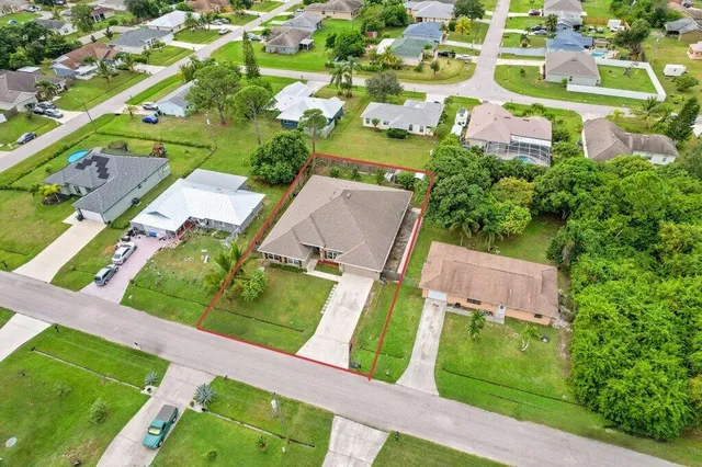 an aerial view of a house with a garden