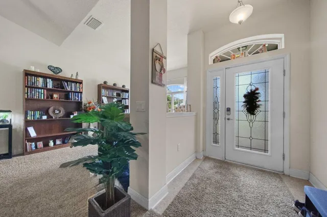an entryway with a flower pot