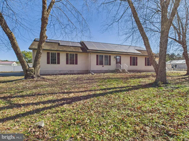 a house with trees in the background