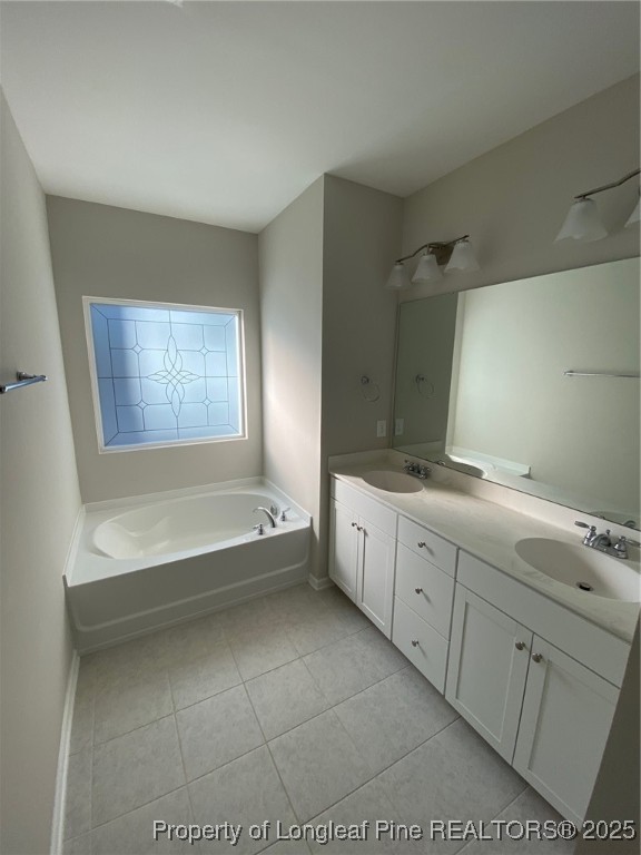 1206 Wingstem Place Cary, NC 27607 - Photo 15 of 26 a spacious bathroom with a tub sink and mirror