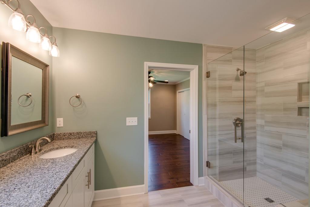2700 Mashburn Road Nashville, TN 37210 - Photo 14 of 23 En suite master bathroom with large double vanities and shower with ceramic tile.