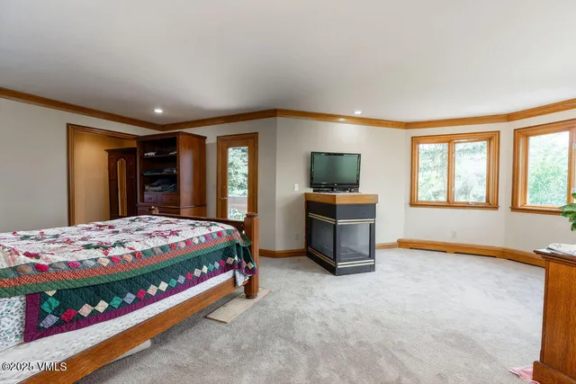 a bedroom with bed and window