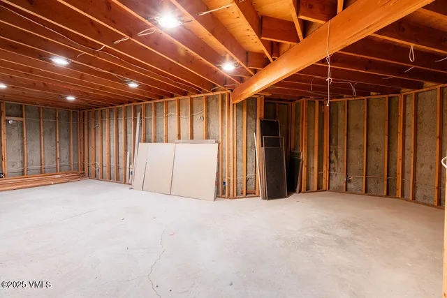 a view of an empty room with wooden walls