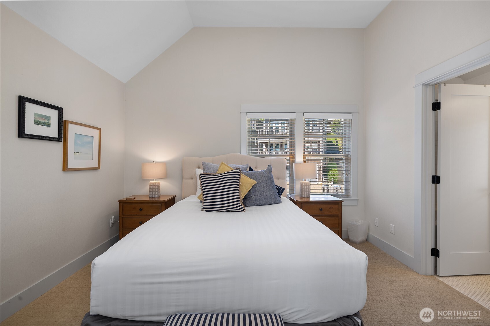 34 Seaside Lane Pacific Beach, WA 98571 - Photo 19 of 33 a bedroom with a large bed and wooden floor