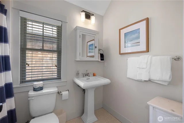 a view of a hallway with washer and dryer