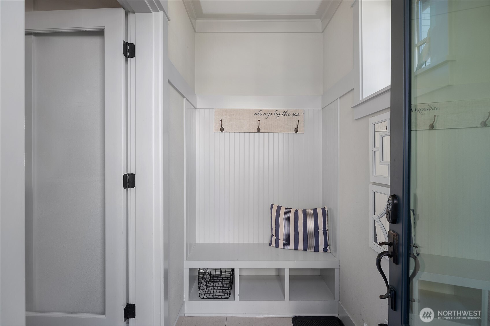 34 Seaside Lane Pacific Beach, WA 98571 - Photo 3 of 33 a view of a hallway with chairs and door