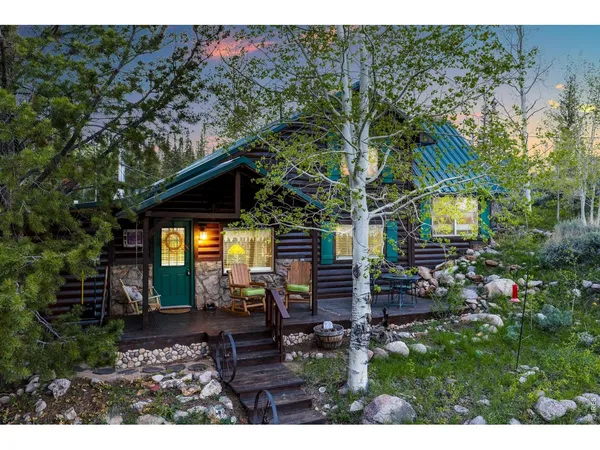a view of house with yard outdoor seating and green space