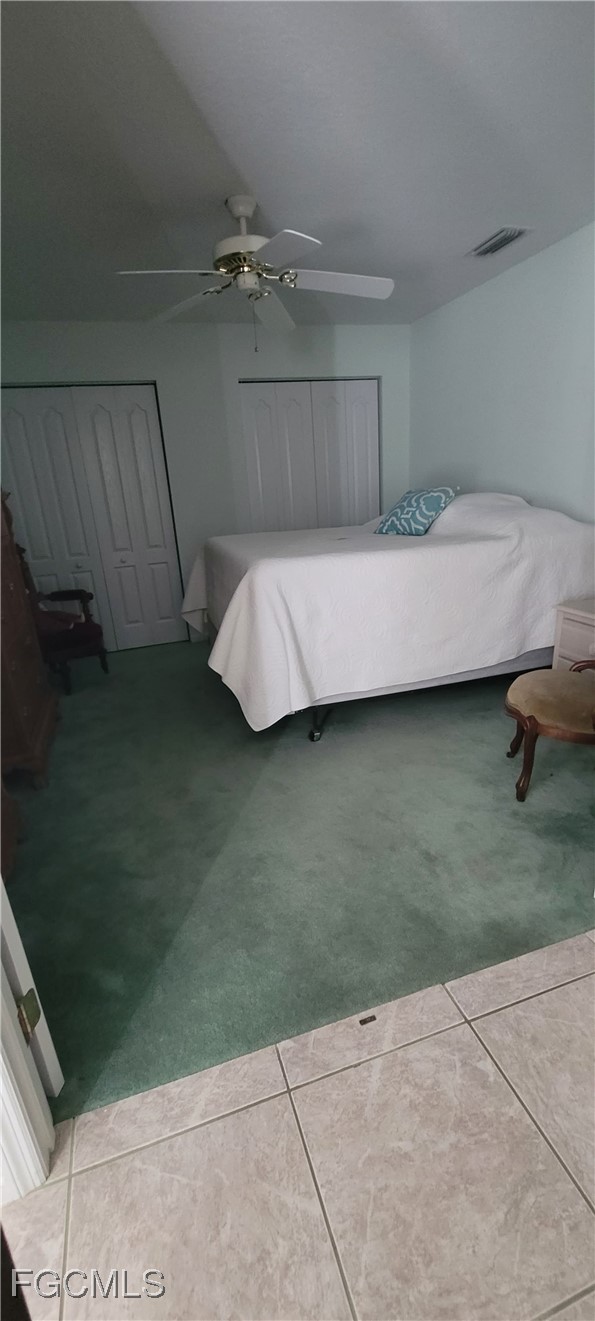 126-128 Tangerine Road Lake Placid, FL 33852 - Photo 11 of 29 a bedroom with a bed and a table
